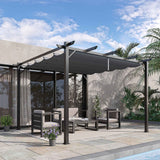 A stylish NatureScape Living 10x10 retractable aluminum pergola with a dark gray canopy shades modern outdoor furniture by a pool.