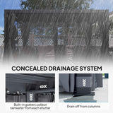 A NatureScape Living 10x13 Ret retractable pergola under rain, highlighting its concealed drainage system with gutters collecting water that drains from columns.