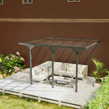 NatureScape Living's 12x10 Polycarbonate Pergola features a bronze translucent roof, shading a white patio set on a deck.