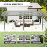 NatureScape Living's 12x20 wood pergola, a sturdy grey structure, shades a modern patio with an outdoor sofa and white flowers.
