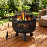 NatureScape Living's 24 Inch Wood Burning Fire Pit with Log Grate and Mesh Screen, burning on a wooden deck.