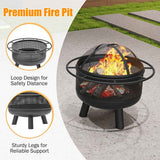 A black 24 Inch Wood Burning Fire Pit with a mesh screen, log grate, safety loop handles, and sturdy legs, burning on a patio.