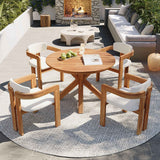 NatureScape Living's 5-piece Acacia Wood Patio Set, featuring a round dining table and four chairs with beige cushions on an outdoor patio.