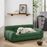 A comfy green dog sofa bed with backrest and armrests features a white bulldog lounging in a modern living room.