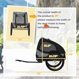 A black dog bike trailer on an outdoor path highlights its 28-inch overall width, advising measuring door frames before purchase.