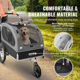 A golden retriever in a gray VEVOR 2-in-1 Pet Stroller Trailer, highlighting comfortable, breathable material and a secure base.