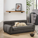 A cream dog lounges on NatureScape Living's elegant and comfortable dark gray Large Dog Sofa Bed in a bright living space.