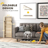 A light wood NatureScape Living Foldable Pet Ramp for Couch is shown folded flat and being stored under a gray sofa.