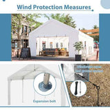 NatureScape Living's white 16x32FT Heavy Duty Party Tent, highlighting wind protection measures like expansion bolts and ground anchors.
