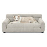 NatureScape Living's luxurious light grey dog sofa bed with backrest and armrests, featuring a relaxing dog.