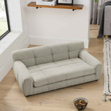 Luxurious light grey dog sofa bed from The Animal Sanctuary, featuring tufted back and armrests, on a wooden floor.
