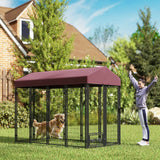 A golden retriever inside NatureScape Living's walk-in dog kennel with a maroon roof and rotating bowl holders on a green lawn.