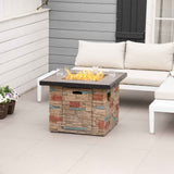 A NatureScape Living 32-inch square faux stone fire pit table with active flames on a patio with a white sectional sofa.