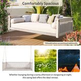 A white TOPMAx wood porch swing bed, "Comfortably Spacious," with ropes, a cream mattress, and pillows on an outdoor deck for lounging.