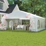 NatureScape Living heavy-duty wedding party tent with sidewalls, set on a green lawn with festive pink and white balloons and decorated dining tables.