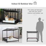 Dark brown wicker dog house, a raised rattan puppy/cat bed, with a corgi on its white cushion for indoor/outdoor use.