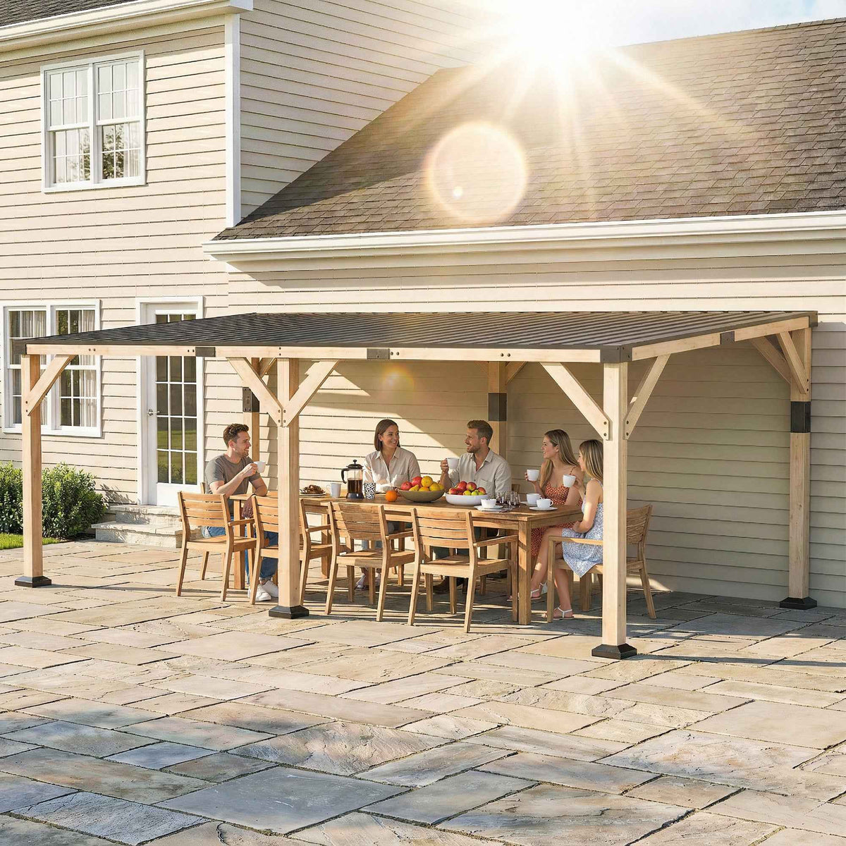NatureScape Living's 10x20 wooden lean-to gazebo with a steel roof shades friends dining on a sunny patio.