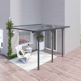 NatureScape Living's dark grey 12x10 Polycarbonate Pergola with a transparent roof covers a cozy deck lounge area.