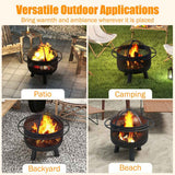 A black 24-inch wood burning fire pit with mesh screen shown in versatile outdoor applications on a patio and beach.