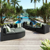 NatureScape Living's luxurious 7 Piece Wicker Sofa Set with black wicker, gray cushions, and striped green pillows on a pool patio.