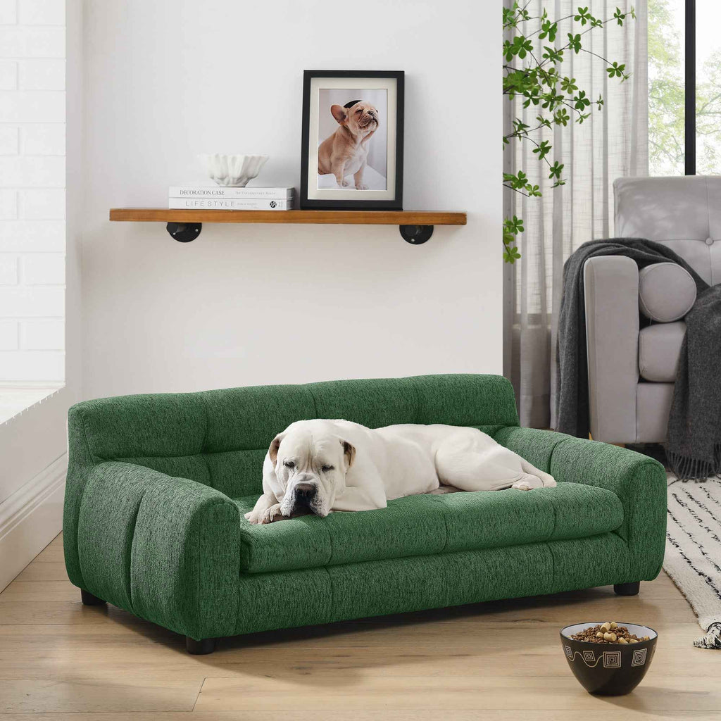A comfy green dog sofa bed with backrest and armrests features a white bulldog lounging in a modern living room.