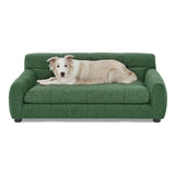 A fluffy dog relaxes on NatureScape Living's green Comfy Large Dog Sofa Bed with backrest and armrests.