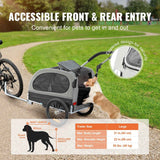 A dog jumps into the gray and black Dog Bike Trailer, emphasizing its "Accessible Front & Rear Entry" and "Zippered design for security" in a park.