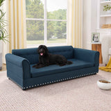 Oversized elegant modern blue linen dog sofa bed with rolled arms and nailhead trim, a black dog lounges comfortably.