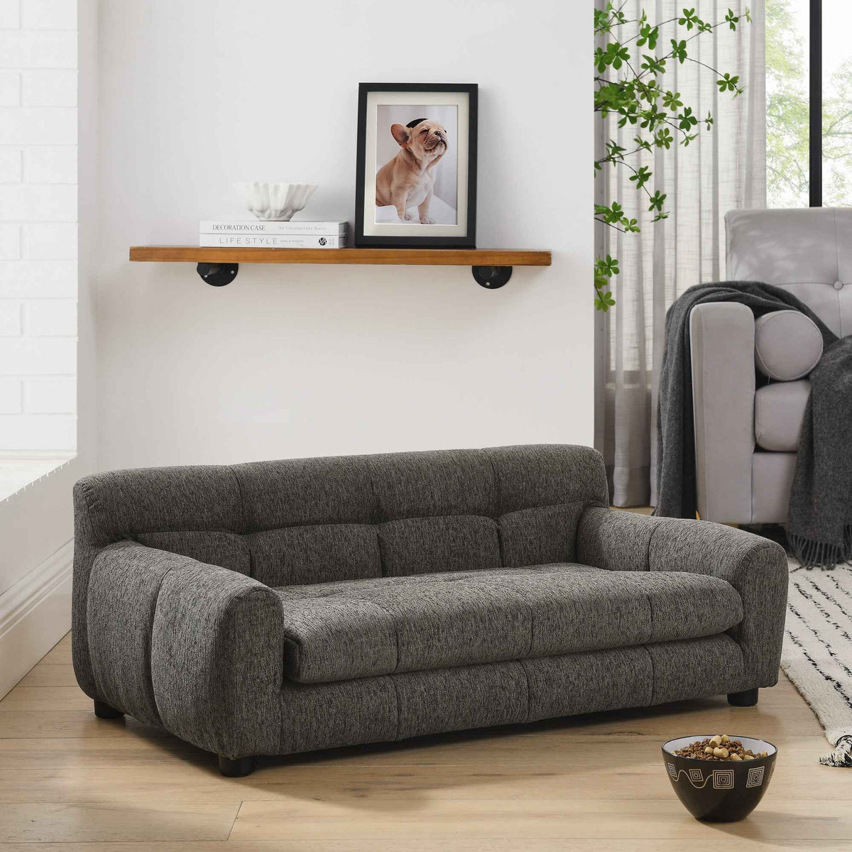 A dark gray tufted Elegant & Comfortable Large Dog Sofa Bed provides a stylish lounge for medium or large pets in a bright living room.