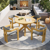 NatureScape Living's 5-piece acacia wood round patio dining set with gray cushions on a bright outdoor patio.