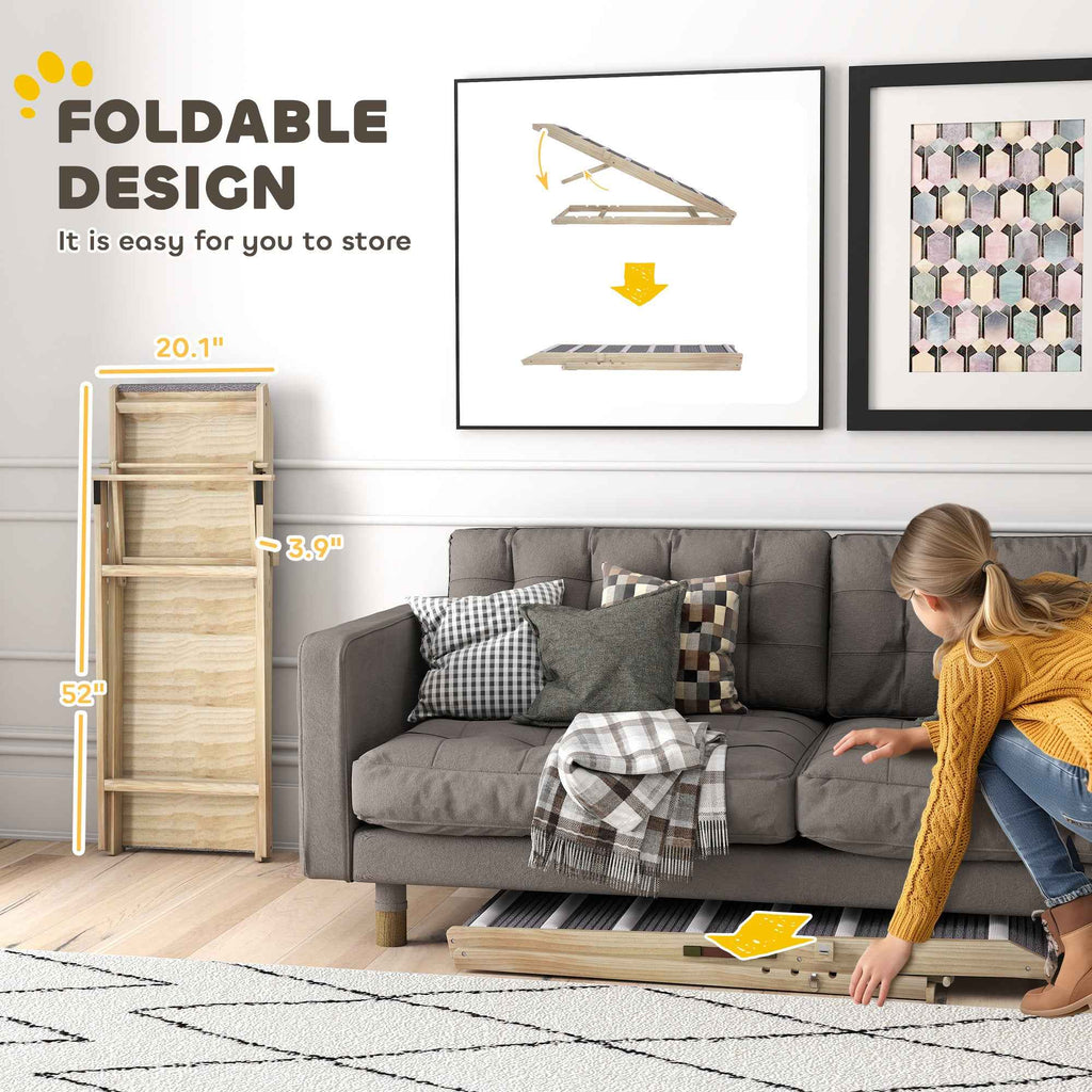 A light wood NatureScape Living Foldable Pet Ramp for Couch is shown folded flat and being stored under a gray sofa.