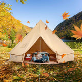 A beige NatureScape Living Glamping Bell Tent, a spacious yurt, with a family inside, surrounded by autumn leaves.