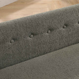 Close-up of an oversized dark grey linen fabric pet sofa's backrest with elegant tufted buttons.