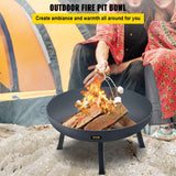 A dark gray VEVOR Round Fire Pit Bowl, made of carbon steel, burning with logs as people roast marshmallows at a campsite.