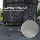 A dark, wood-grain NatureScape Living smokeless fire pit rests on a silver aluminum foil mat, emphasized as fireproof for safety.
