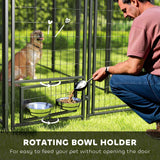 NatureScape Living's walk-in dog kennel, featuring a rotating bowl holder as a man feeds a golden retriever.
