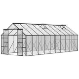 A NatureScape Living walk-in greenhouse kit with a black frame, clear panels, roof vents, and double doors.