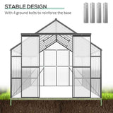 A NatureScape Living aluminum and polycarbonate walk-in greenhouse, showing its stable design with 4 ground bolts securing it into soil.