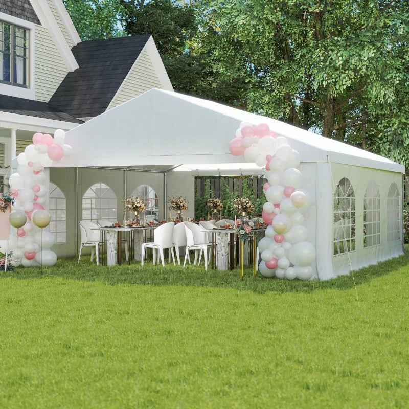 NatureScape Living heavy-duty wedding party tent with sidewalls, set on a green lawn with festive pink and white balloons and decorated dining tables.
