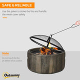An Outsunny 18-inch wood burning fire pit with a rustic design, featuring a hand safely lifting its mesh spark cover with a poker.