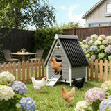 NatureScape Living's stylish grey and black wooden chicken coop for happy hens in a vibrant backyard with hydrangeas.